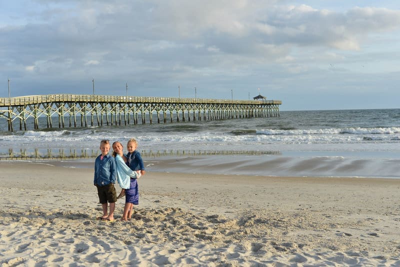 Children posing on Oak Island beach for portrait